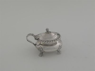 Appraisal: A William IV oval bellied mustard pot on four paw