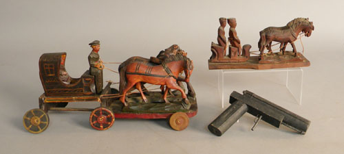 Appraisal: Two carved wooden figural groups one with a horse drawn