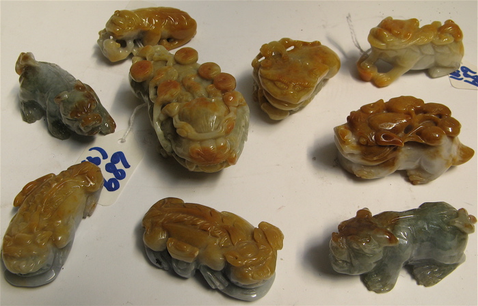 Appraisal: NINE HAND SCULPTED CARVED JADEITE FIGURES OF STYLIZED FOO FU