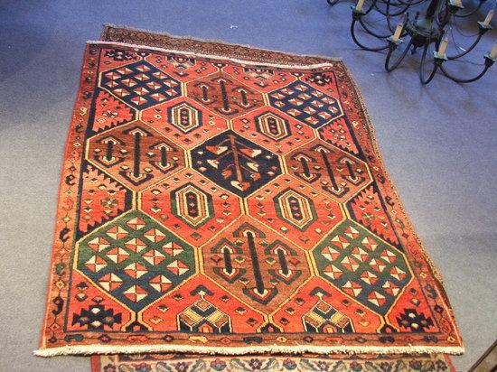 Appraisal: A BAKTIAR MULTICOLOUR WOOLLEN RUG with an all over design