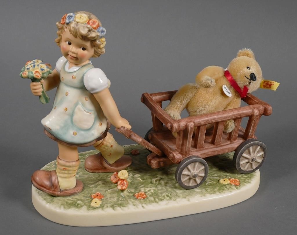 Appraisal: Large Hummel Tag Along Teddy Girl pulling wagon with Steiff