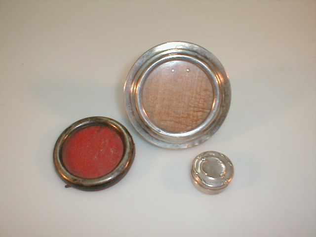 Appraisal: Two small silver photo frames and a pill box