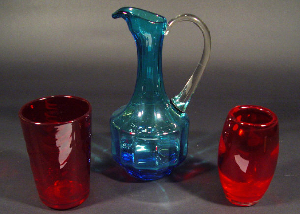 Appraisal: Two Whitefriars red glass vases one with wavy decoration and