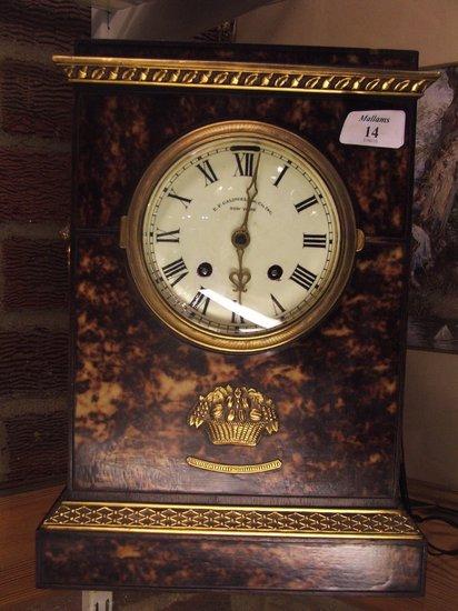 Appraisal: AN AMERICAN FAUX TORTOISESHELL MANTEL CLOCK having a circular white