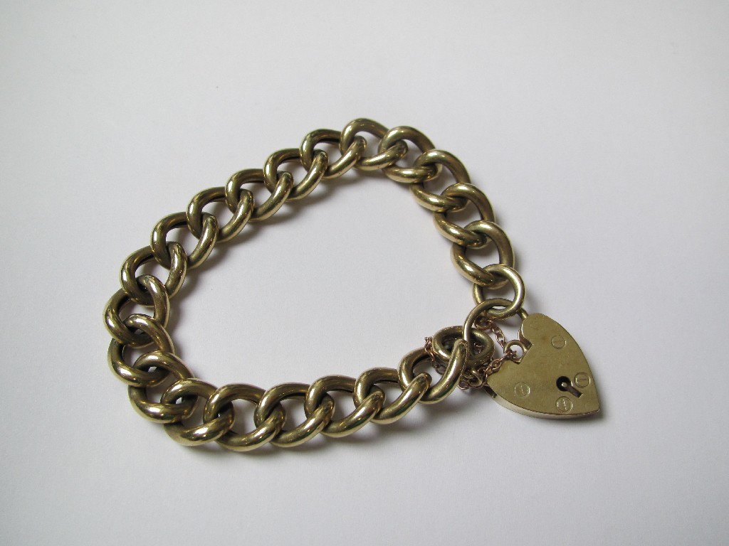 Appraisal: Nine carat gold curb link bracelet complete with padlock and