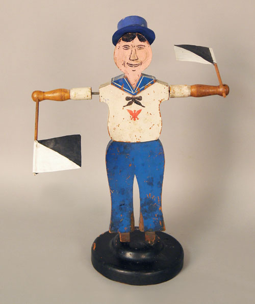 Appraisal: Whirligig of a sailor th c branded CEW on base