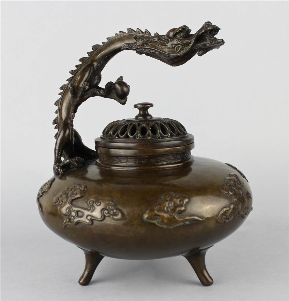 Appraisal: JAPANESE BRONZE GLOBULAR TRIPOD CENSER WITH DRAGON AND PIERCED CHRYSANTHEMUM