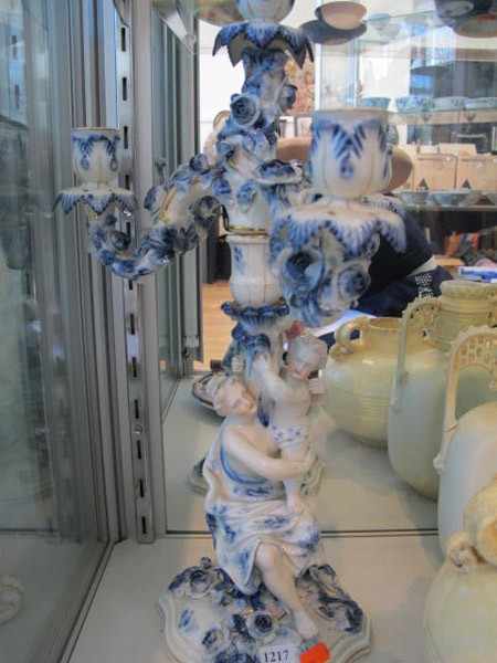 Appraisal: A PAIR OF SITZENDORF PORCELAIN BLUE AND WHITE FIGURAL CANDELABRA