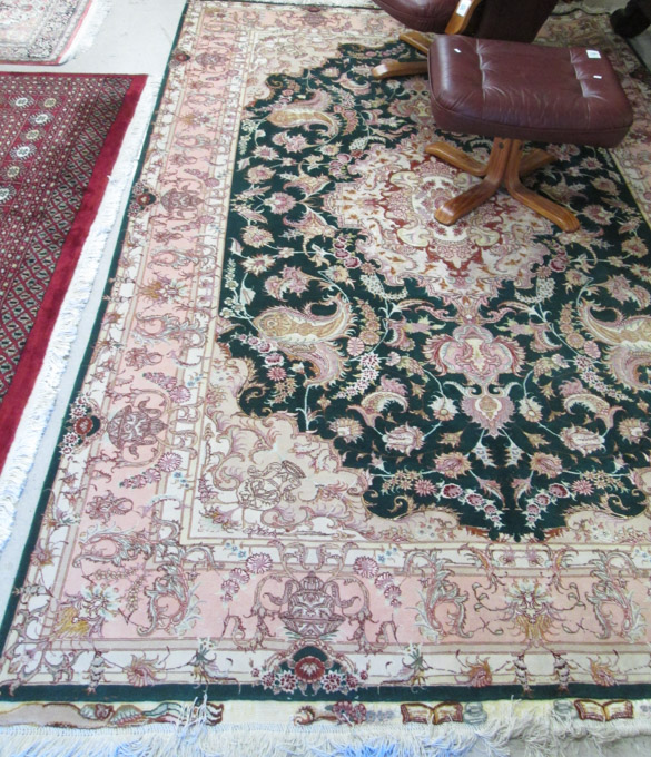 Appraisal: PERSIAN WOOL SILK CARPET floral and central floral medallion design