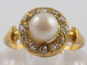 Appraisal: A French hallmarked carat gold diamond and cultured pearl cluster