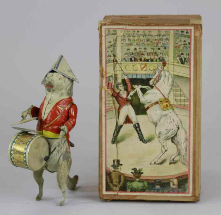 Appraisal: GUNTHERMANN BOXED DOG WITH DRUM Germany hand painted tin amusing