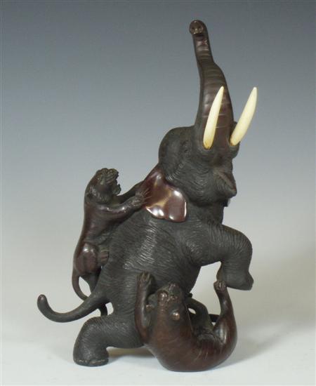 Appraisal: A Japanese bronze elephant Meiji period the elephant being attacked