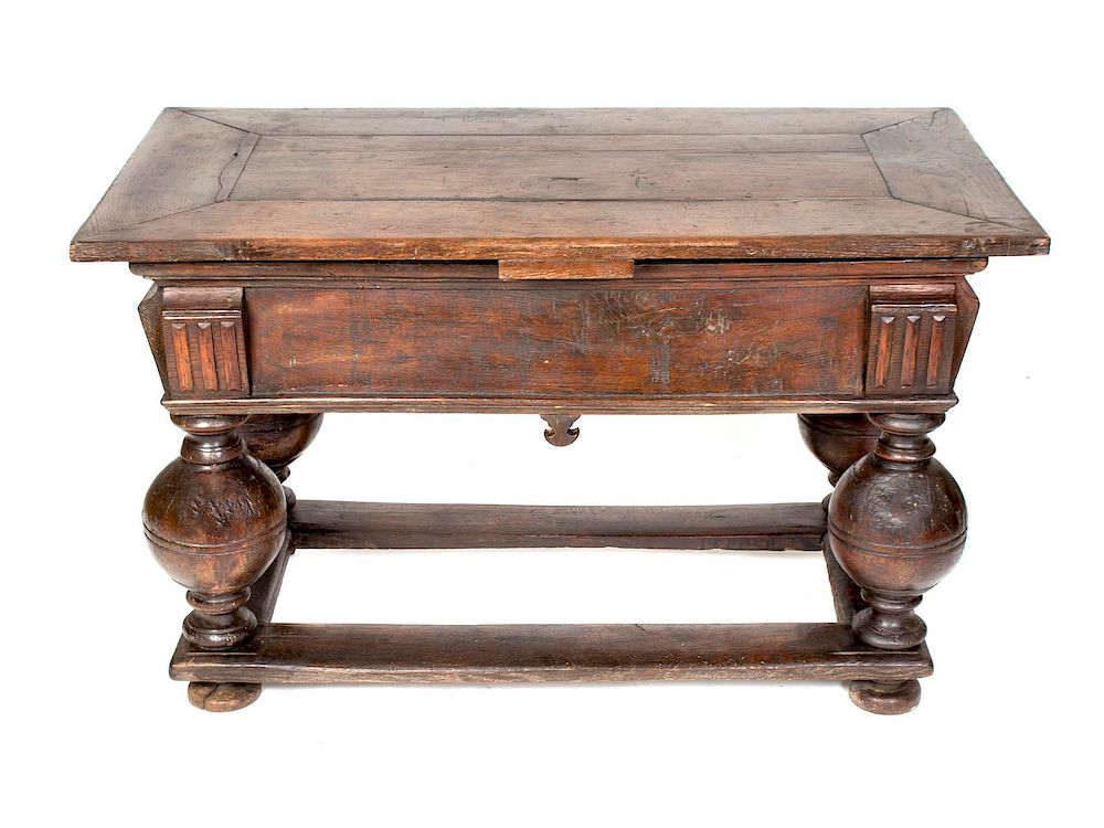 Appraisal: A Flemish Carved Oak Draw Leaf or Bolpoottafel Table Height