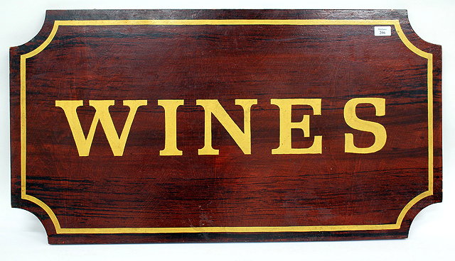 Appraisal: AN OLD MAHOGANY SIGN 'Wines' in gold script cm x