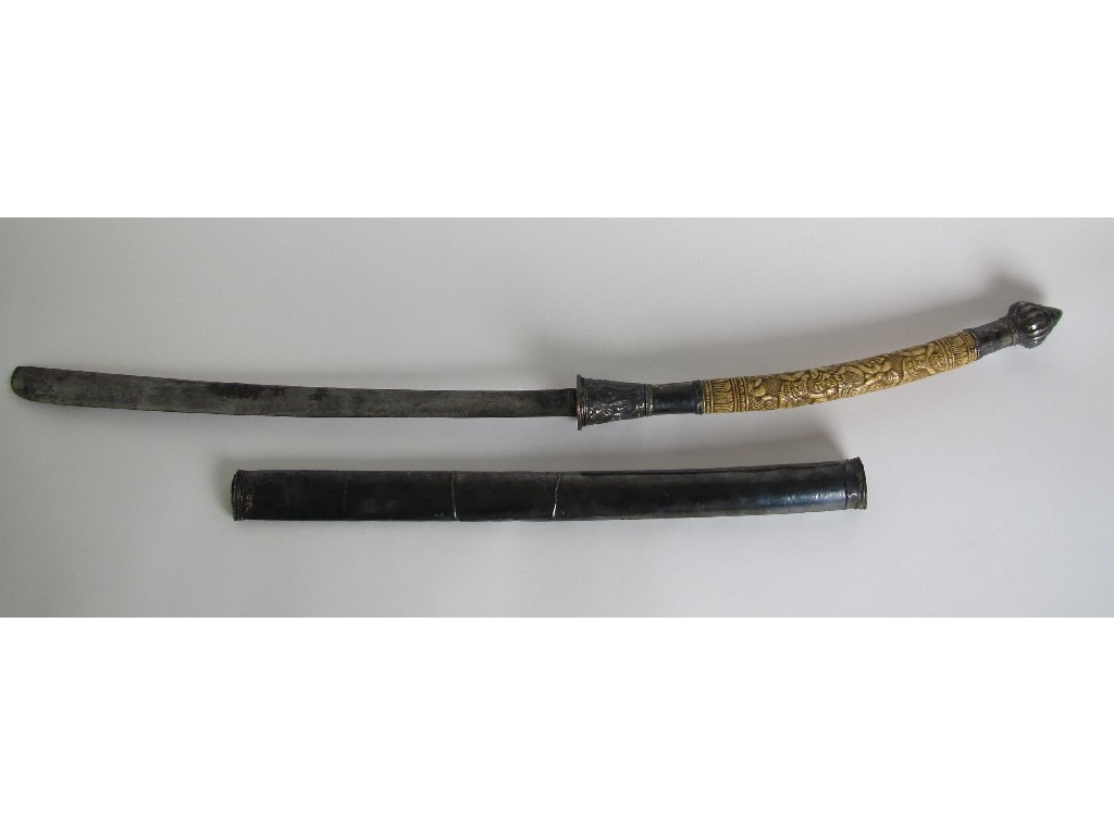 Appraisal: A Burmese sword with carved bone handle fluted pommel and