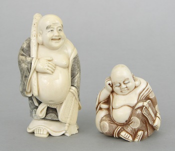 Appraisal: Two Carved Ivory Men ca Early th Century Standing fat