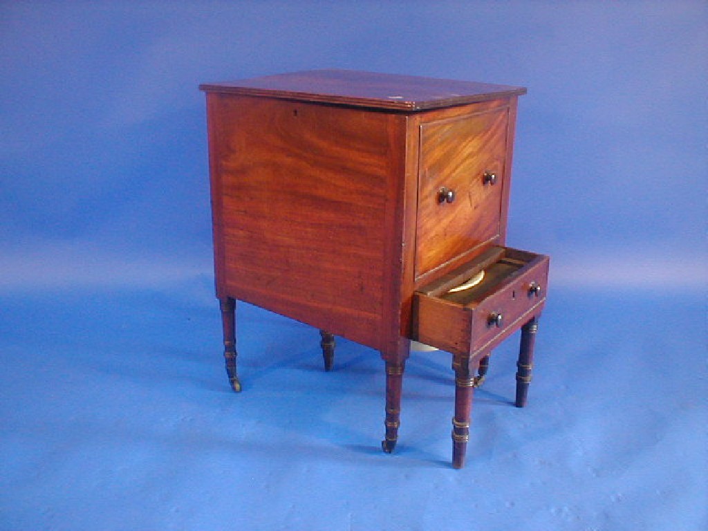 Appraisal: A George III mahogany commode with lift top faux drawers