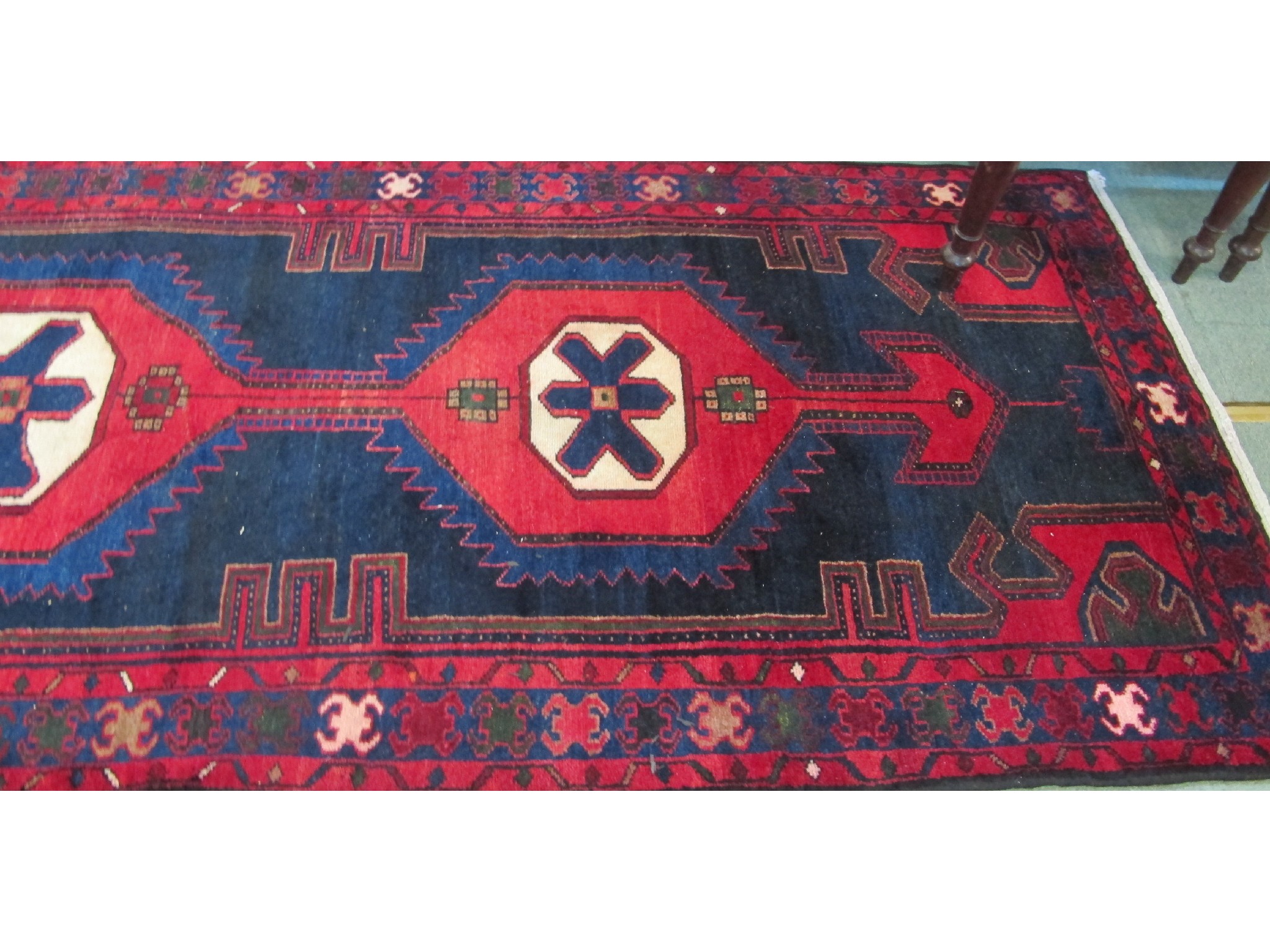 Appraisal: Hamadan runner on a red and blue ground x m