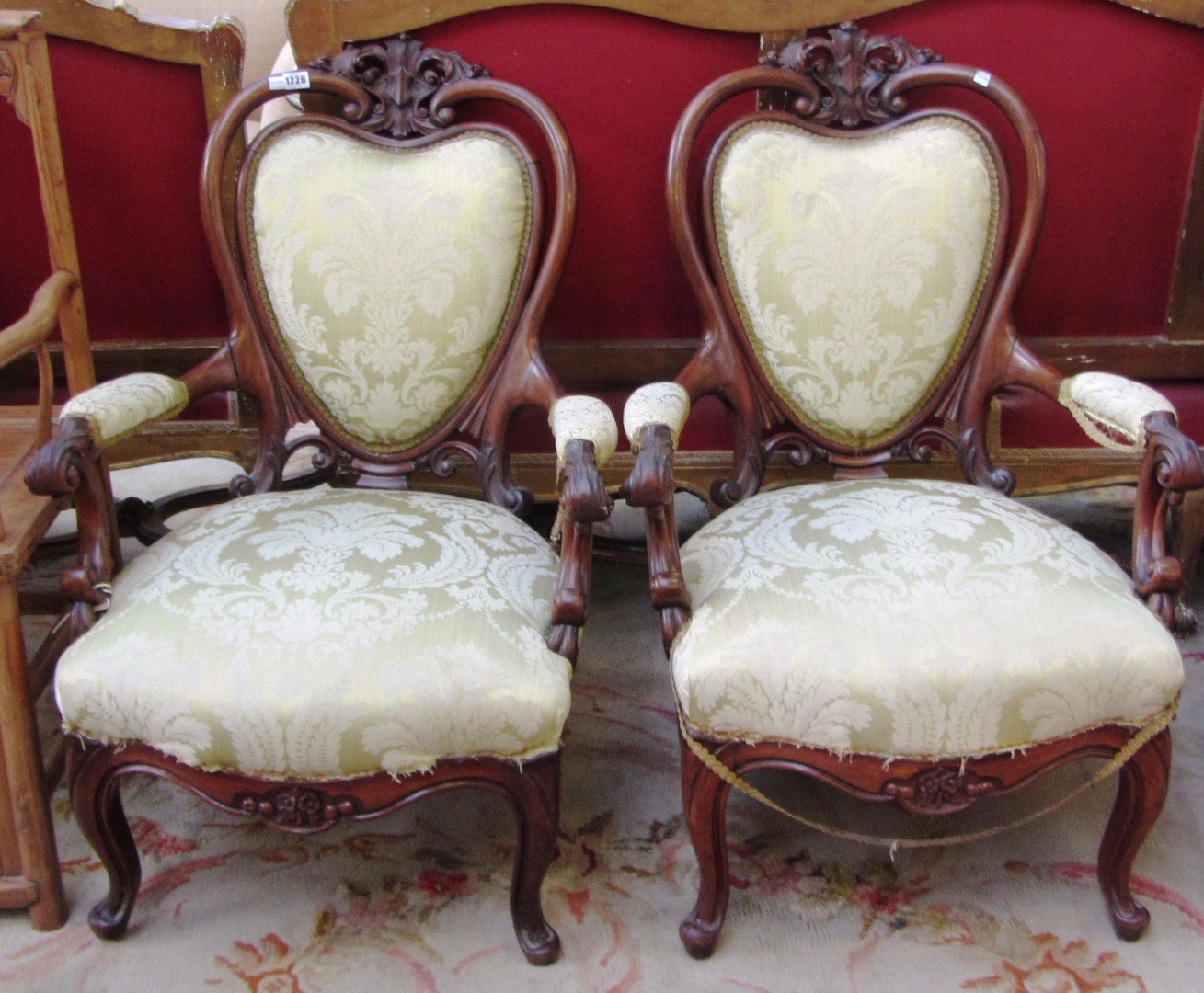 Appraisal: A pair of Victorian mahogany framed open armchairs with pierced