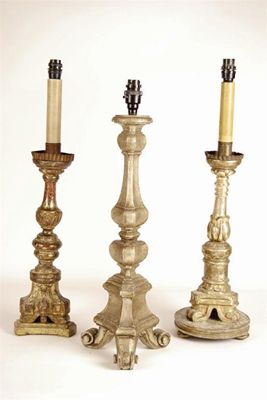 Appraisal: Three Italian turned silvered wood and gesso altar table lamps