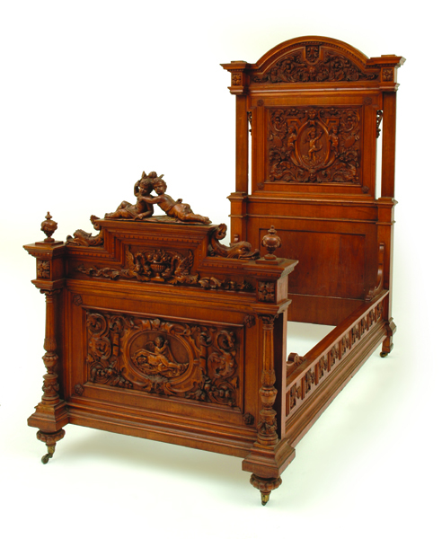 Appraisal: AN ITALIAN RENAISSANCE STYLE WALNUT BED The panelled back ornately