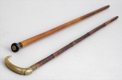 Appraisal: HORN-HANDLED FRUITWOOD STICK AND A HORN-HANDLED CANE The one with