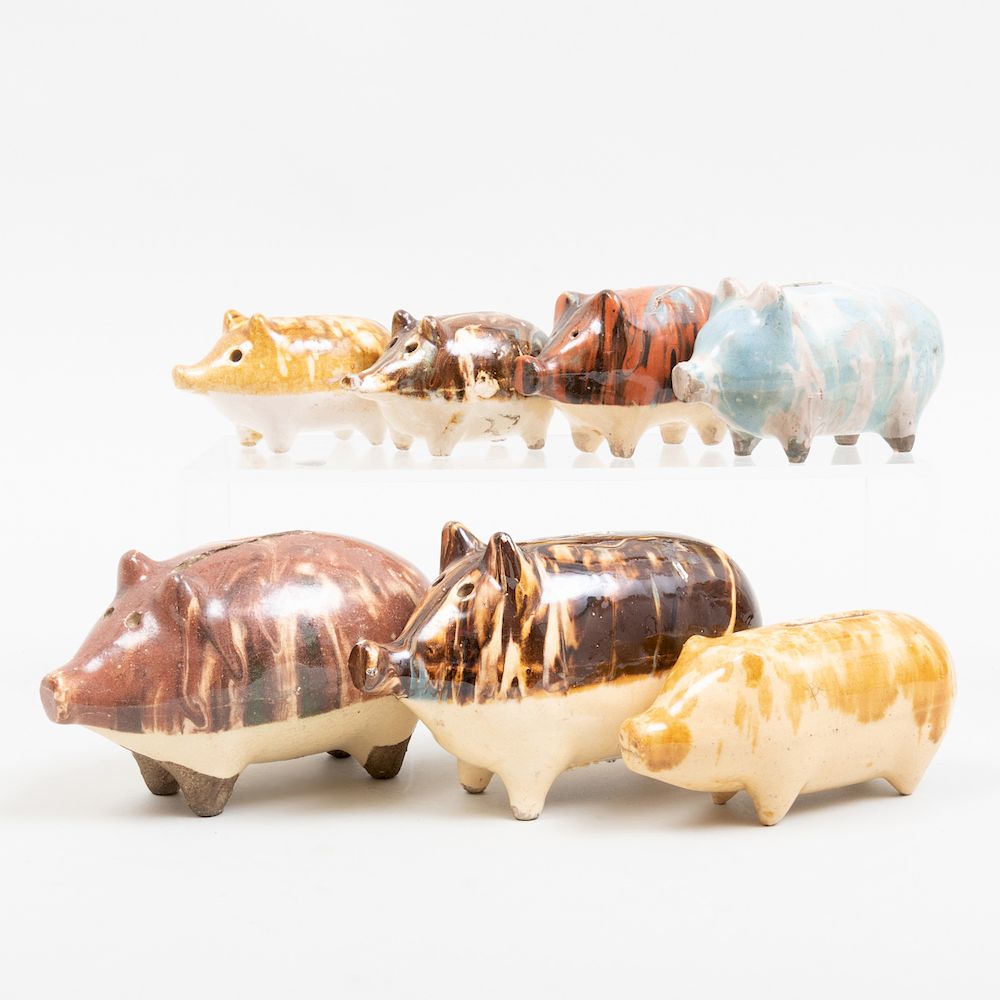 Appraisal: Group of Seven Glazed Pottery Piggy Banks The largest in