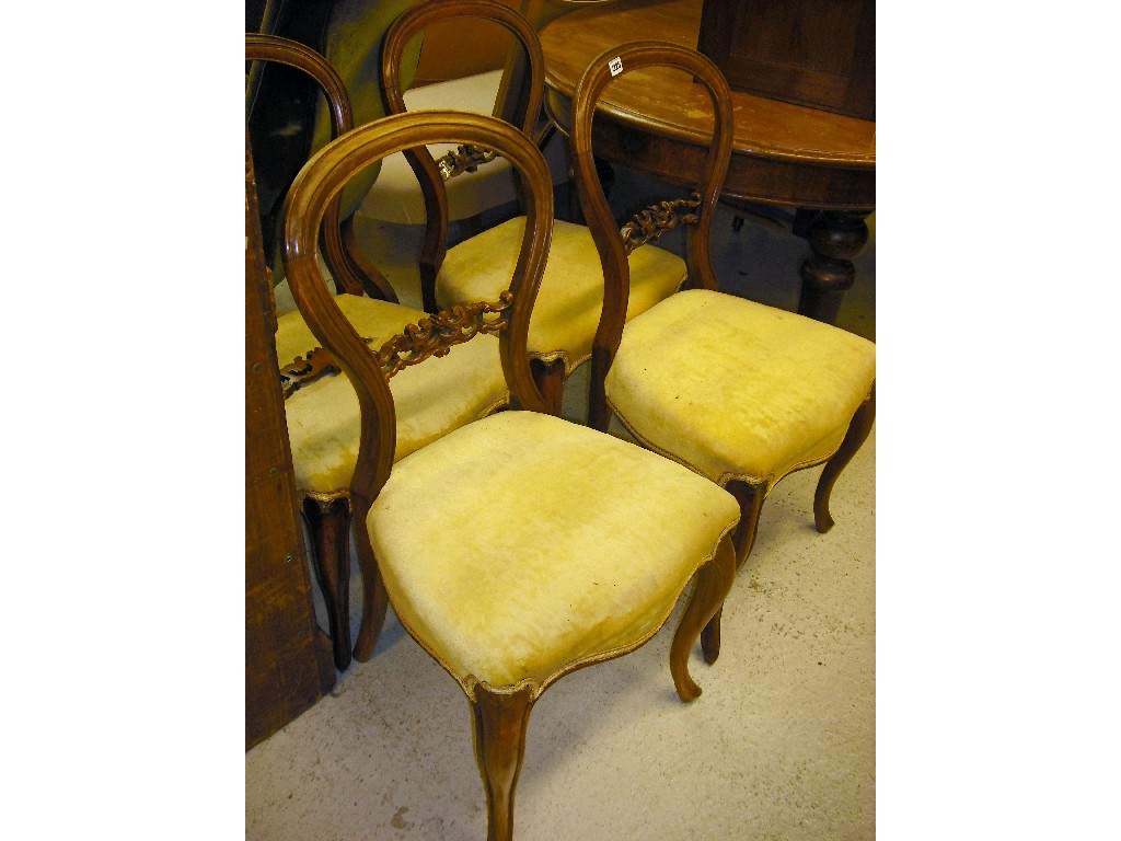 Appraisal: Set of four Victorian walnut balloon back dining chairs with