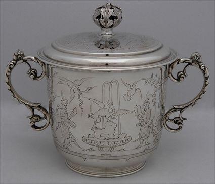 Appraisal: WILLIAM AND MARY-STYLE ENGRAVED SILVER FOOTED TWO-HANDLED CUP AND COVER