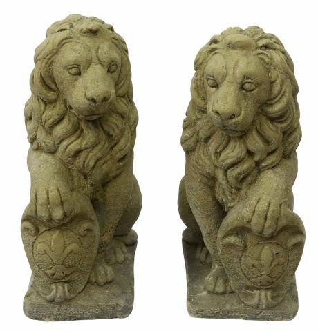 Appraisal: pair Cast stone garden statuary seated lions each with textured