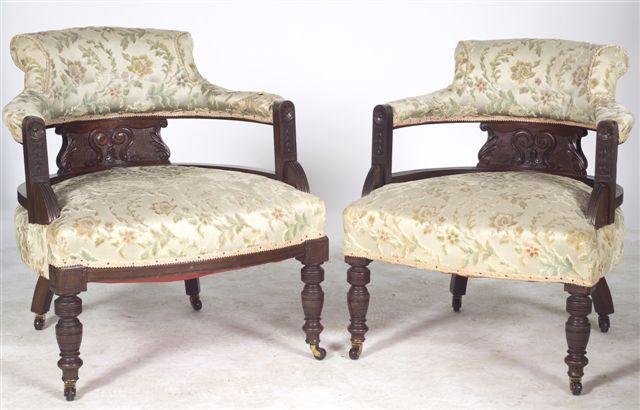 Appraisal: PAIR OF VICTORIAN MAHOGANY ARMCHAIRS each with upholstered and scroll-carved