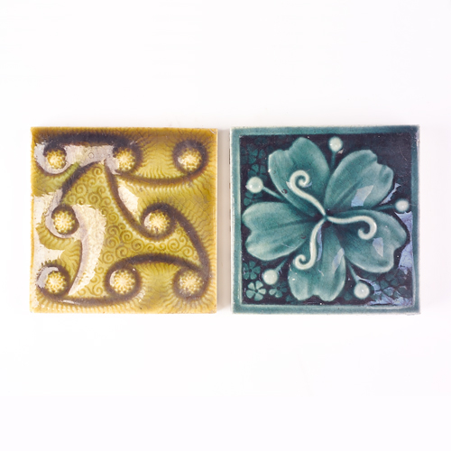 Appraisal: TRENT Two sq tiles with modeled designs one with swirls