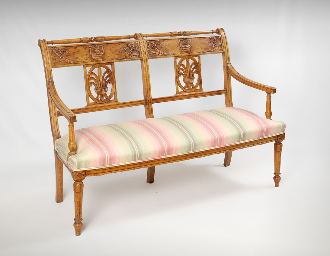 Appraisal: CONTINENTAL CARVED FRUITWOOD SETTEE th century pegged construction turned top