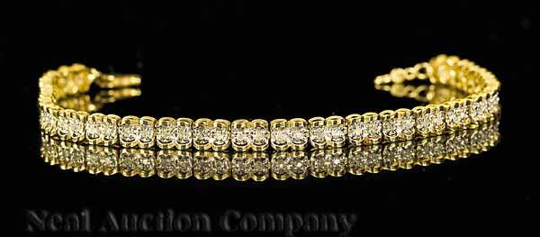 Appraisal: A Yellow Gold and Diamond Flexible Bracelet set with small