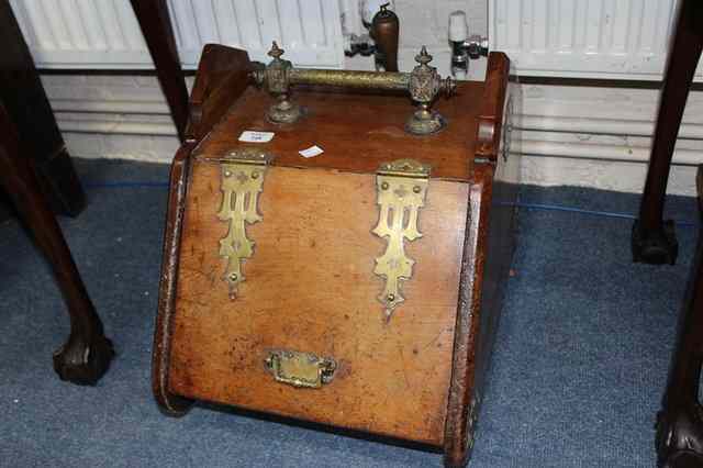 Appraisal: A VICTORIAN OAK AND BRASS BOUND COAL BOX complete with