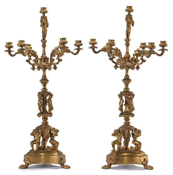 Appraisal: A pair of Renaissance style bronze seven light figural candelabra