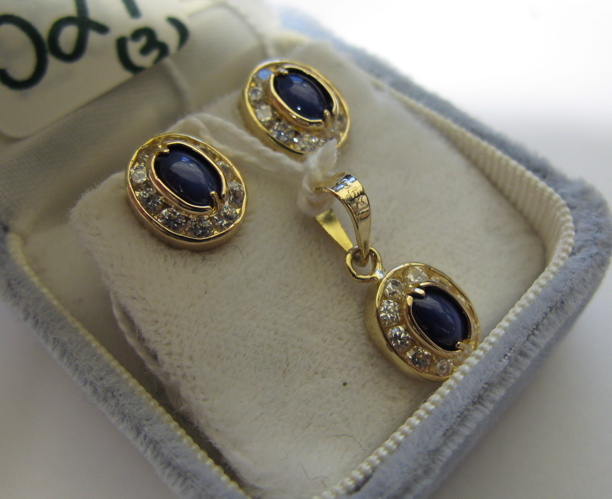 Appraisal: PAIR OF STAR SAPPHIRE DIAMOND AND FOURTEEN KARAT EARRINGS WITH