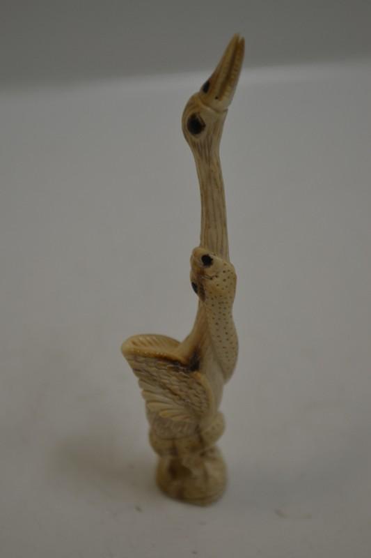 Appraisal: S JAPANESE CARVED IVORY SNAKE ENCIRCLING STALK NETSUKE