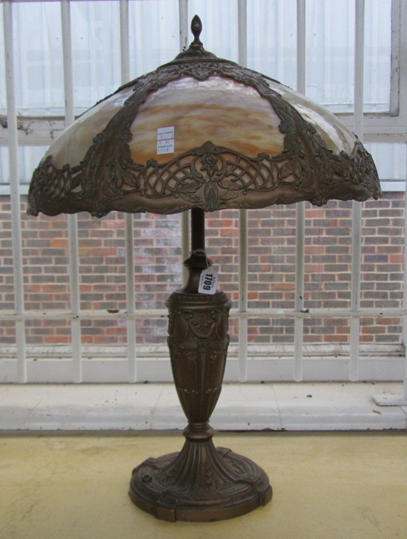 Appraisal: A French bronzed metal and opaque glass table lamp early