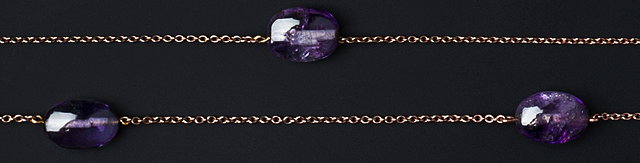 Appraisal: AN AMETHYST BEAD NECKLACE the continuous trace-link chain spaced by