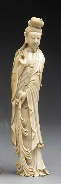 Appraisal: A carved ivory figure of Guanyin Shown with elaborately dressed