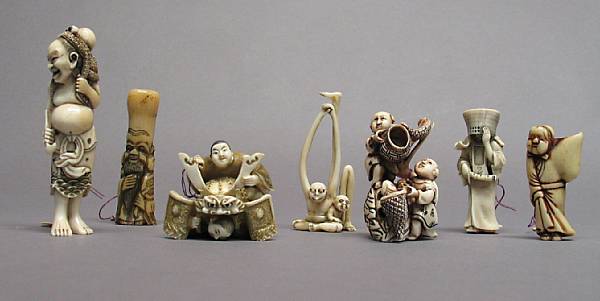 Appraisal: A group of seven ivory and stag antler figural netsuke