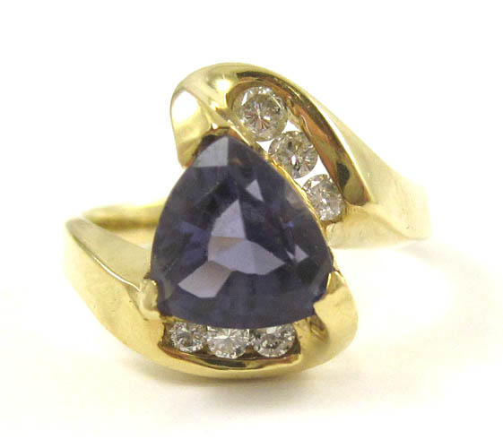 Appraisal: TANZANITE DIAMOND AND FOURTEEN KARAT GOLD RING with six round-cut