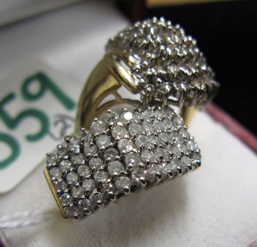 Appraisal: TWO DIAMOND AND FOURTEEN KARAT GOLD CLUSTER RINGS each ring