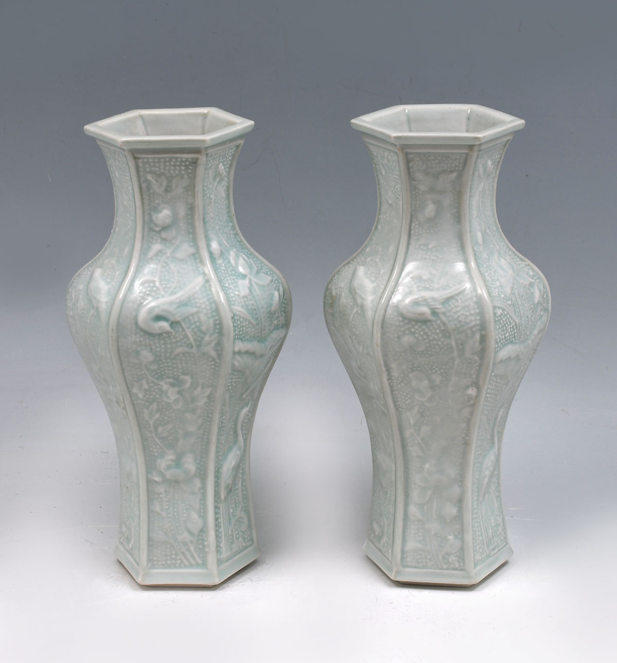 Appraisal: TWO HEXAGONAL CELADON CHINESE VASES Overall birds floral designs Light