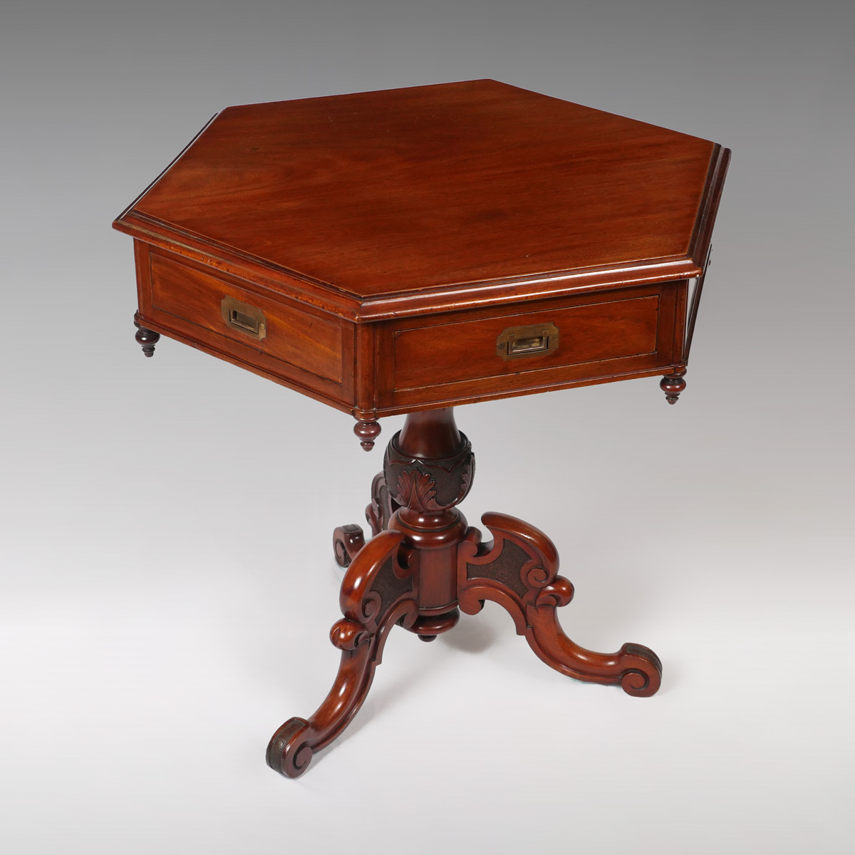 Appraisal: ENGLISH MAHOGANY HEXAGONAL RENT TABLE sided top skirt with drawers