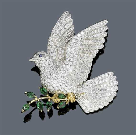 Appraisal: DIAMOND AND TSAVORITE CLIP BROOCH White and yellow gold Elegant