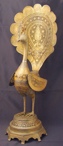 Appraisal: PERSIAN PIERCED METAL MODEL OF A PEACOCK '' high Lehner