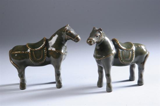 Appraisal: PAIR JAPANESE BROWNISH-GREEN PORCELAIN FIGURES OF HORSES - in high