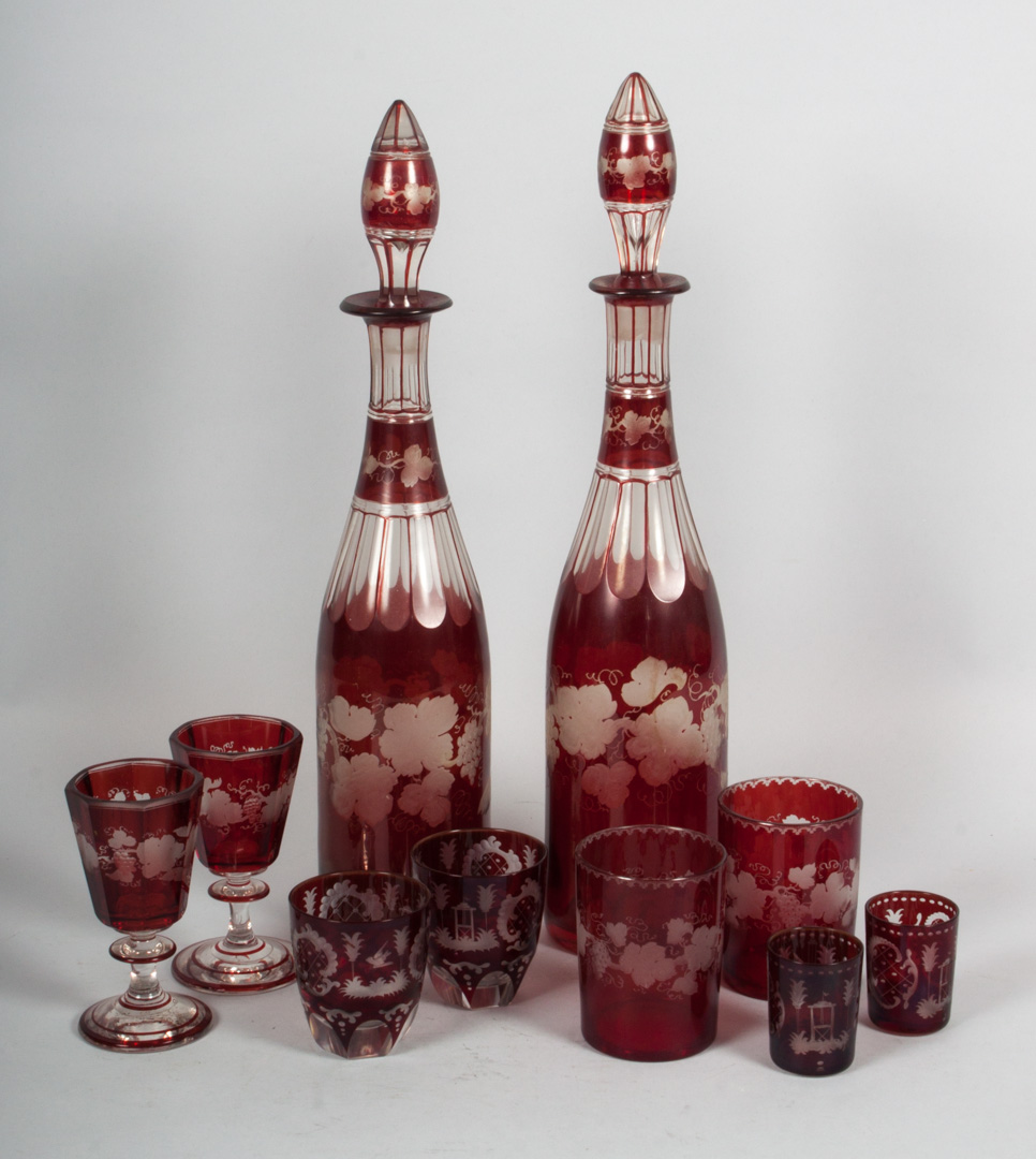 Appraisal: Bohemian ruby glass decanters and cordials first half- th century